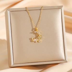 Elegant gold tulip moon pendant necklace with moonstone and cubic zirconia on silk