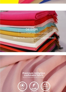 Close-up of soft cashmere-feel fabric texture and fringe detail on warm winter scarves