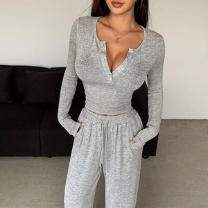 Women's 2-piece grey knit set featuring a long sleeve button top and drawstring pants