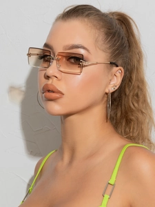 Close-up of rimless gradient brown square sunglasses with slim gold metal temples