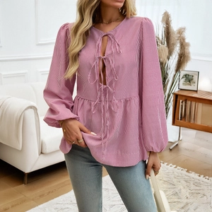 Women's pink striped lantern sleeve shirt with front tie details and ruffle hem