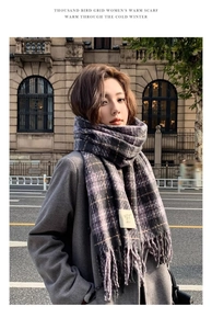 Street style view of soft taro purple plaid scarf with fringe details and woven label