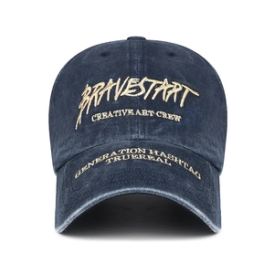 Distressed dark blue washed cotton baseball cap with gold embroidery and frayed brim