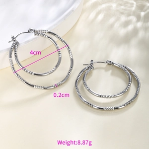 Detail showing 4cm silver chain pattern hoop earrings with diamond-cut texture and dimensions