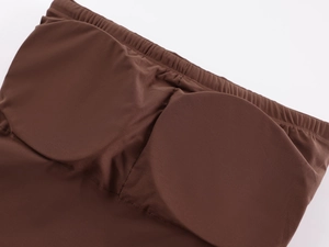 Detail of brown elastic tube top showing thickened padded cups and premium stitching