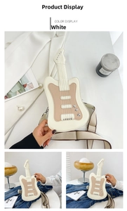 Detail view of a white guitar-shaped crossbody bag with star rivets and fabric strap