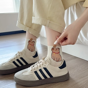 Cute beige cotton socks featuring embroidered capybara cartoon and orange detail