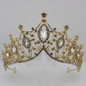Detailed macro view of vintage gold bridal crown with white rhinestones and large gemstones