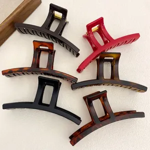 Set of six large matte and glossy hair claws in solid colors and tortoiseshell patterns