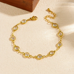Gold plated stainless steel chain bracelet with clear faceted crystals and lobster clasp