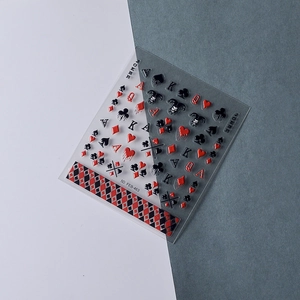 Detailed 5D embossed poker nail stickers featuring red and black spade and heart patterns