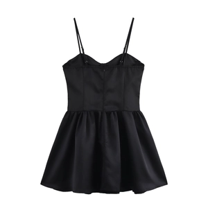Elegant black satin slip dress with thin straps and ruffled A-line hem shown from the back