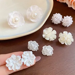 French style pearl and flower earring set with 10 pieces on a ceramic tray display