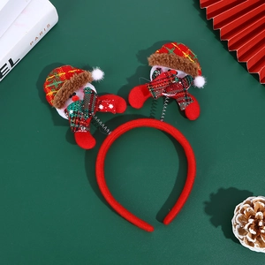 Christmas snowman headband with red spring-loaded motifs on a festive green background