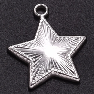 Macro shot of 304 stainless steel star pendant with textured surface and dot details