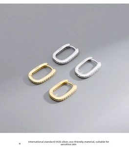 Macro shot of S925 silver pave hoop earrings in gold and silver showing the clasp