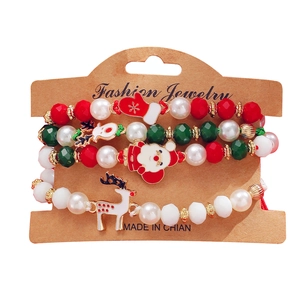 Set di braccialetti natalizi con perline e ciondoli Babbo Natale e renne su cartoncino