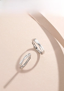 Detailed view of S925 sterling silver Mobius rings with white crystals for couples