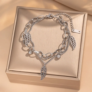 Double-layered stainless steel silver bracelet with leaf pendant and crystal accents