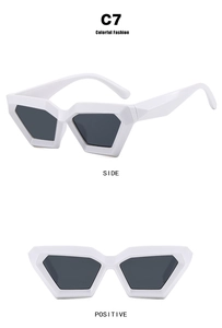 White geometric triangle cat-eye sunglasses with dark lenses from front and side views