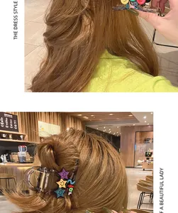 Detail view of a star-shaped hair claw clip with colorful smile patterns on styled hair