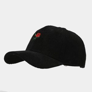 Close-up of a corduroy baseball cap with high-quality red rose embroidery detail