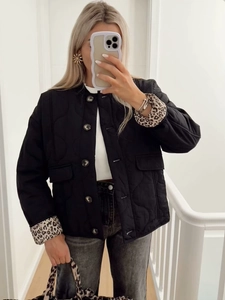 Quilted black winter coat featuring leopard print lining and a matching handbag set