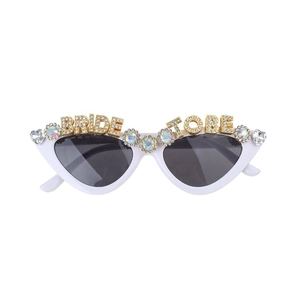 White cat eye bride sunglasses with BRIDE TO BE rhinestones and heart gemstones for parties