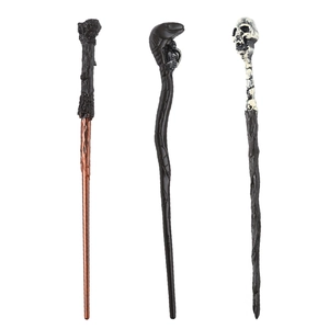 Three magical wands in black, brown, and bone white with skull and snake textures