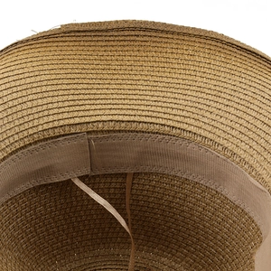 Detailed macro view of woven straw cowboy hat interior with sweatband and adjustable drawstring