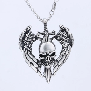 Macro shot of gothic skull and wings pendant with sword detail in antique silver finish
