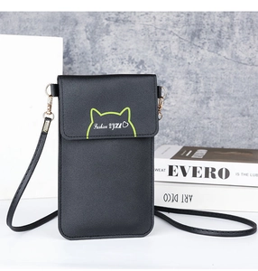 Close-up of black leather phone bag with green cat ear design and shoulder strap