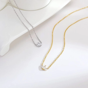 Elegant gold and silver three-leaf clover necklaces with sparkling zircon pendants