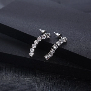 Detail of silver drop earrings with curved row of brilliant-cut cubic zirconia stones