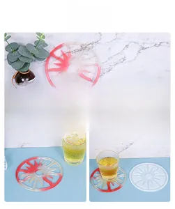 Macro detail of sunburst silicone mold and red-white resin coaster for DIY home decor