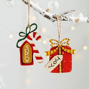 Wooden Christmas tree ornaments with Snow and Joy text on candy cane and gift box tags