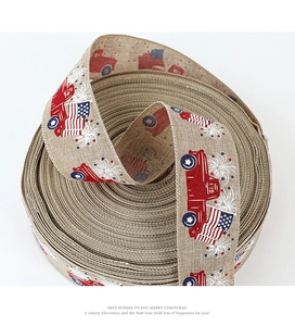 Detail of burlap ribbon featuring vintage red truck and American flag prints for crafts