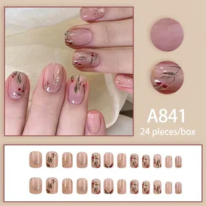 Handmade red bean press-on nails set in soft pink with hand-painted butterfly art