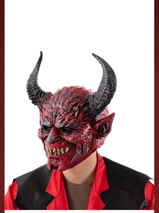 Detail of red demon mask featuring sharp black horns and realistic latex skin texture
