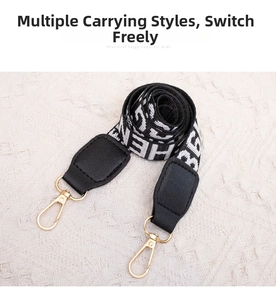Close-up of jacquard woven strap with leather ends and gold-tone swivel lobster clasps