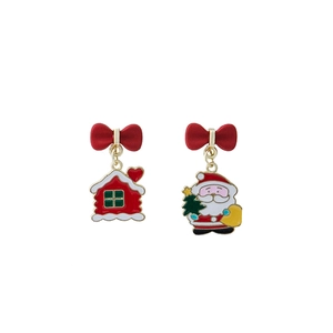 Close-up of asymmetrical Christmas earrings with Santa Claus, snow house and red bows
