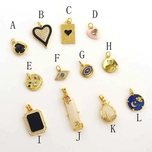 Detailed grid of 12 assorted 18k gold plated charms with heart and onyx designs