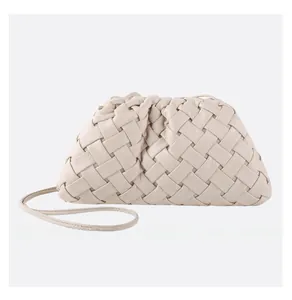 Detail of beige woven leather dumpling bag with soft pleats and fine shoulder strap