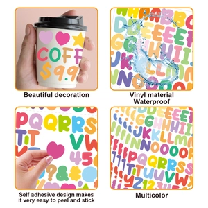 Macro detail of waterproof vinyl alphabet stickers applied to a coffee cup and being peeled