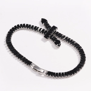 Close-up of hip-hop tennis bracelet featuring black rectangular zircon stones and cross charm