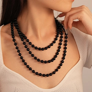 Elegant multi-layer vintage black faux pearl necklace for women shown on model
