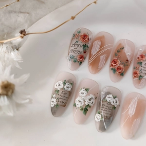 French vintage almond press-on nails with red rose art, pearls, and LOVE and ROSE script