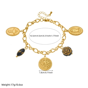 Gold charm bracelet with religious medals, black rose and cross detail measurements