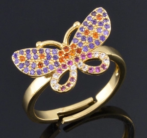 Elegant gold butterfly open ring with colorful zircon stones on a black reflective surface
