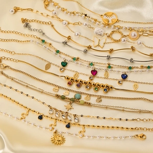 Vintage stainless steel bracelets with pearls, zircons and butterfly pendants set
